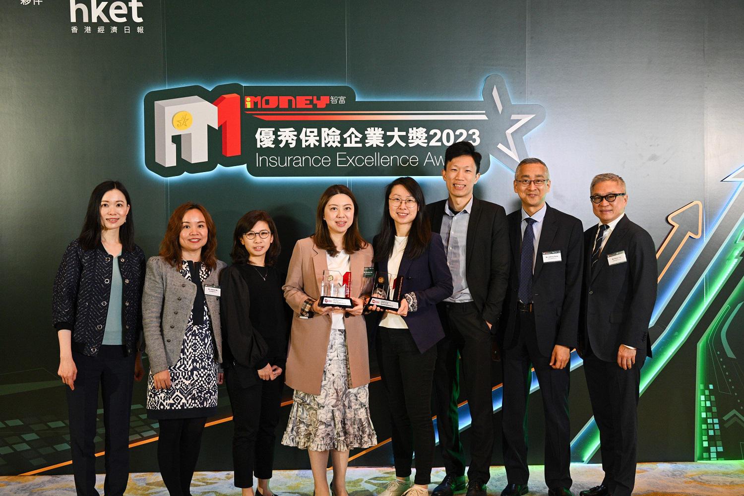 Department heads and representatives of YF Life celebrate the company's win at the ceremony.
