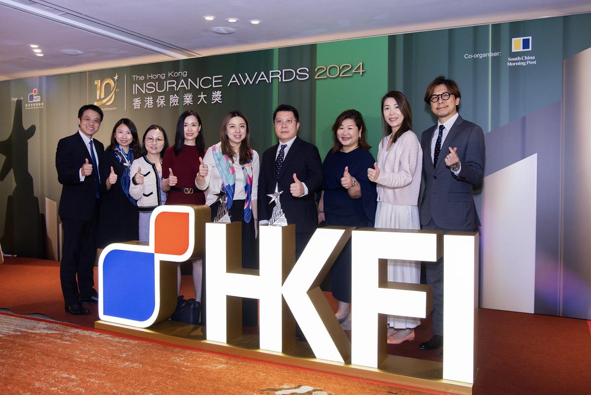 Department heads and representatives of YF Life celebrate the company's win at the ceremony.